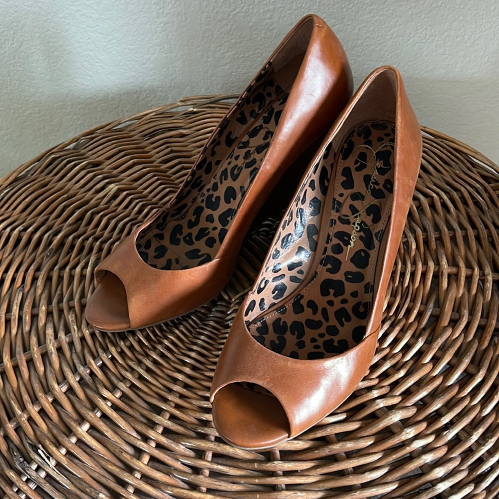Open-toe wedge pumps, saddle-colored leather.